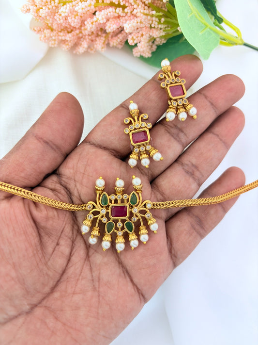 Traditional pattern  premium matte finish necklace and matching earrings crafted with stones and pearls