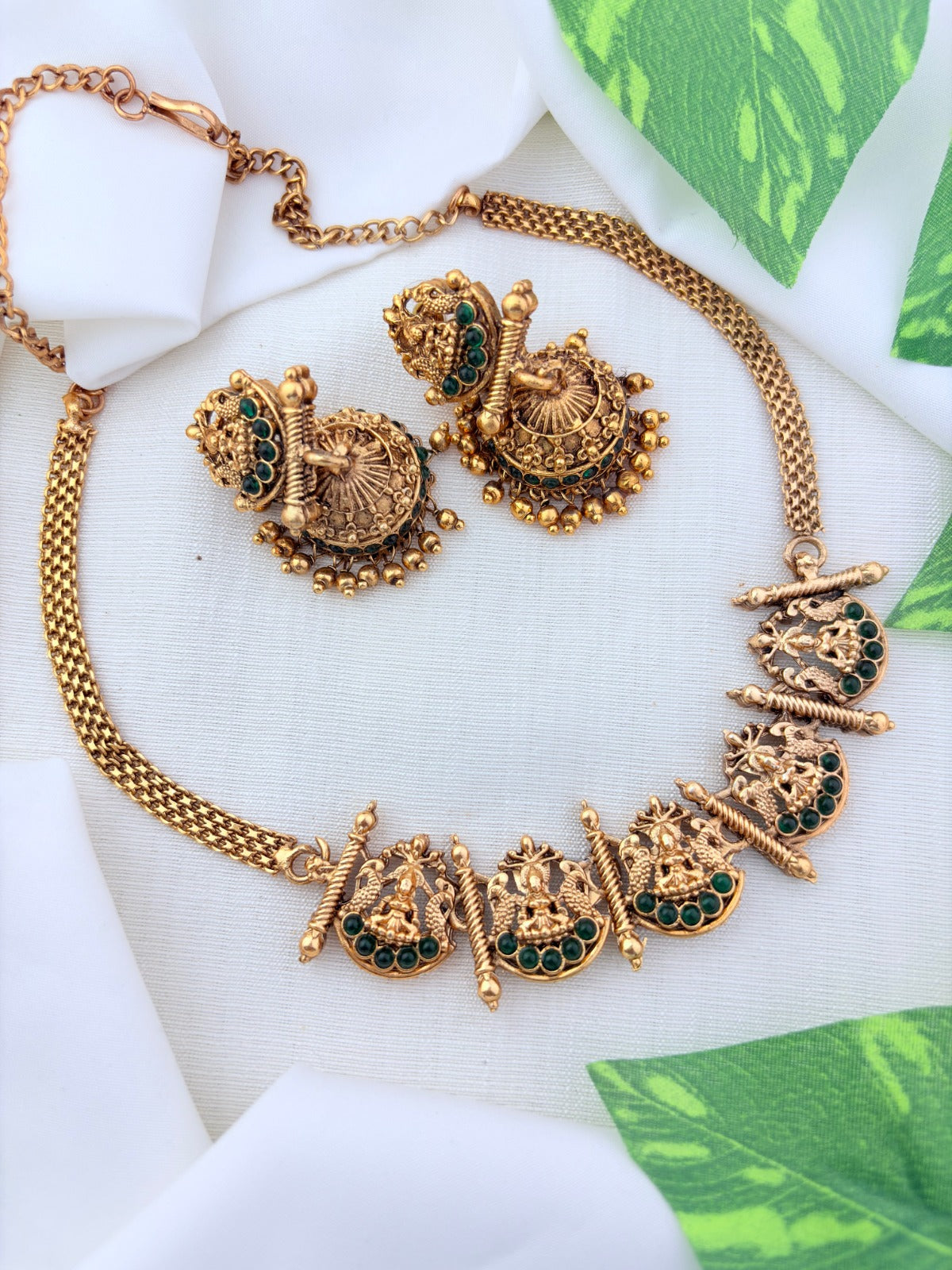 Matte finish Lakshmi choker and matching jumkha adorned with stones and golden beads