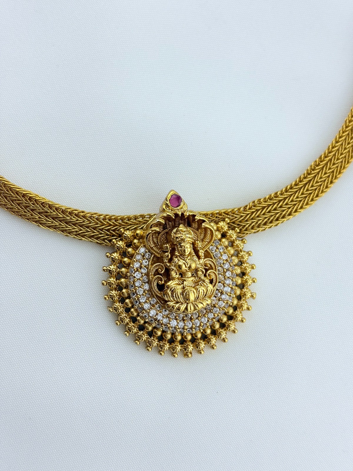 Temple inspired AD stone premium matte finish lakshmi choker set with matching earrings