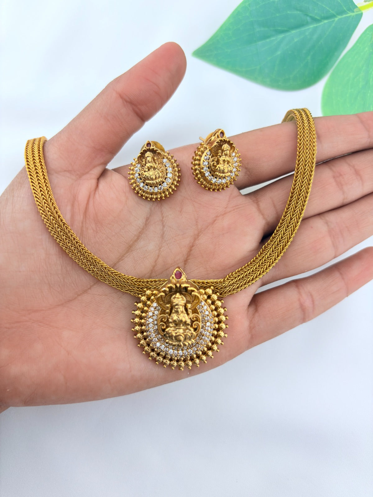 Temple inspired AD stone premium matte finish lakshmi choker set with matching earrings