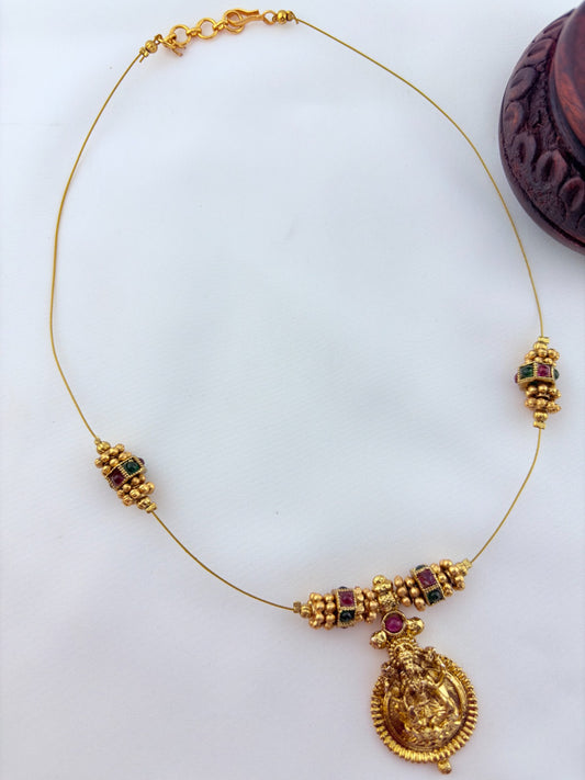 Premium invisible chain Lakshmi pendant adorned with classic stone balls and golden beads
