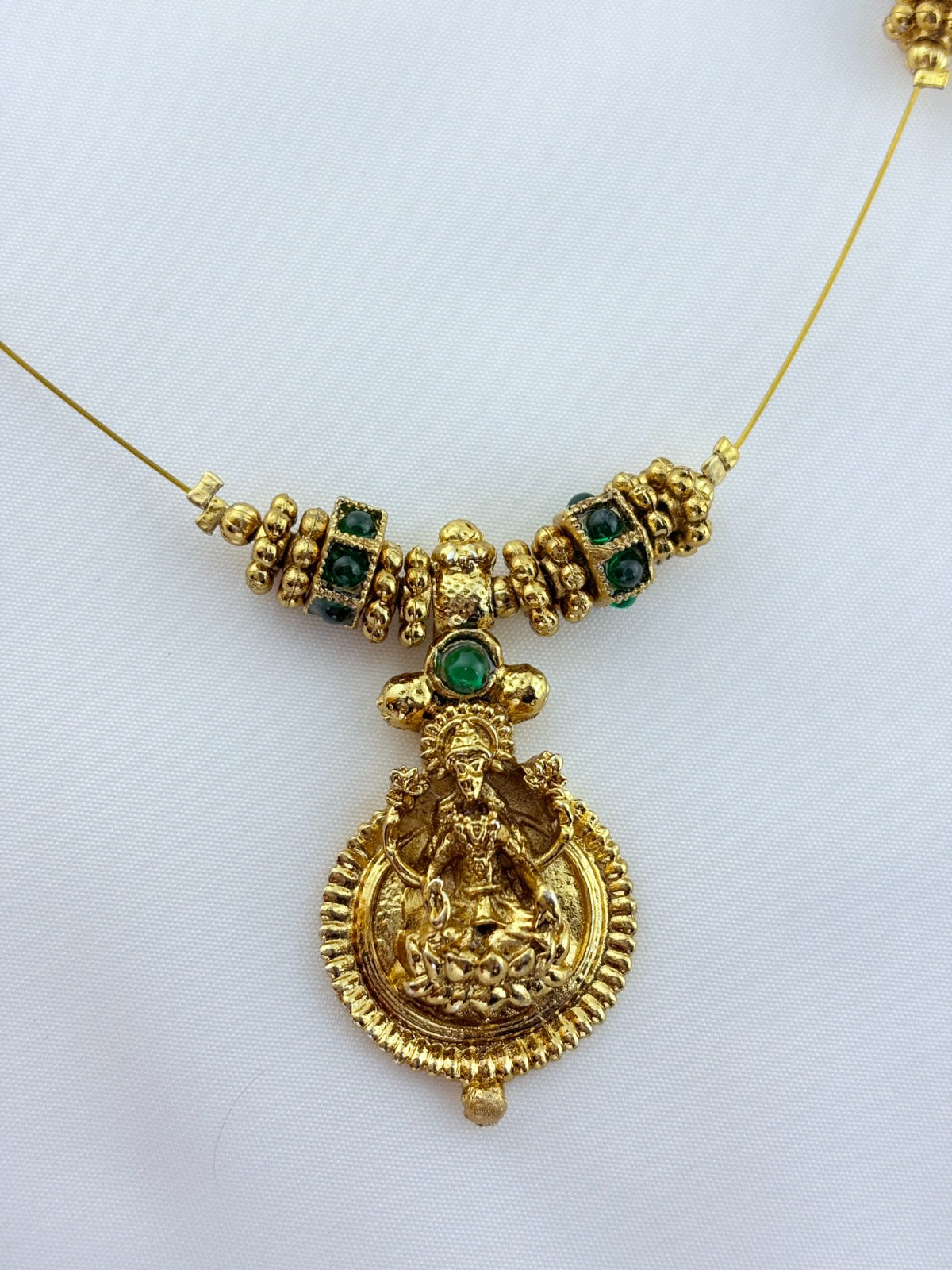 Premium invisible chain Lakshmi pendant adorned with classic stone balls and golden beads