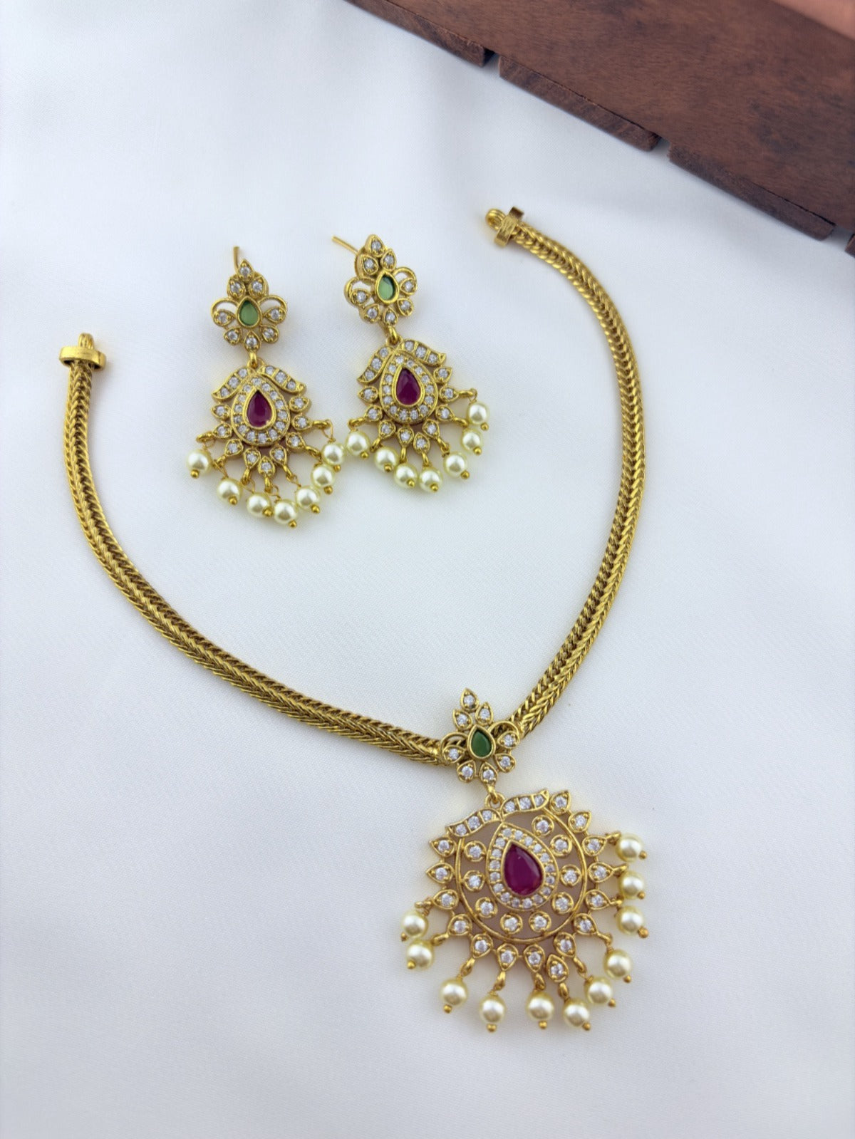 Premium matte finish neckset with classic pendant and matching earrings