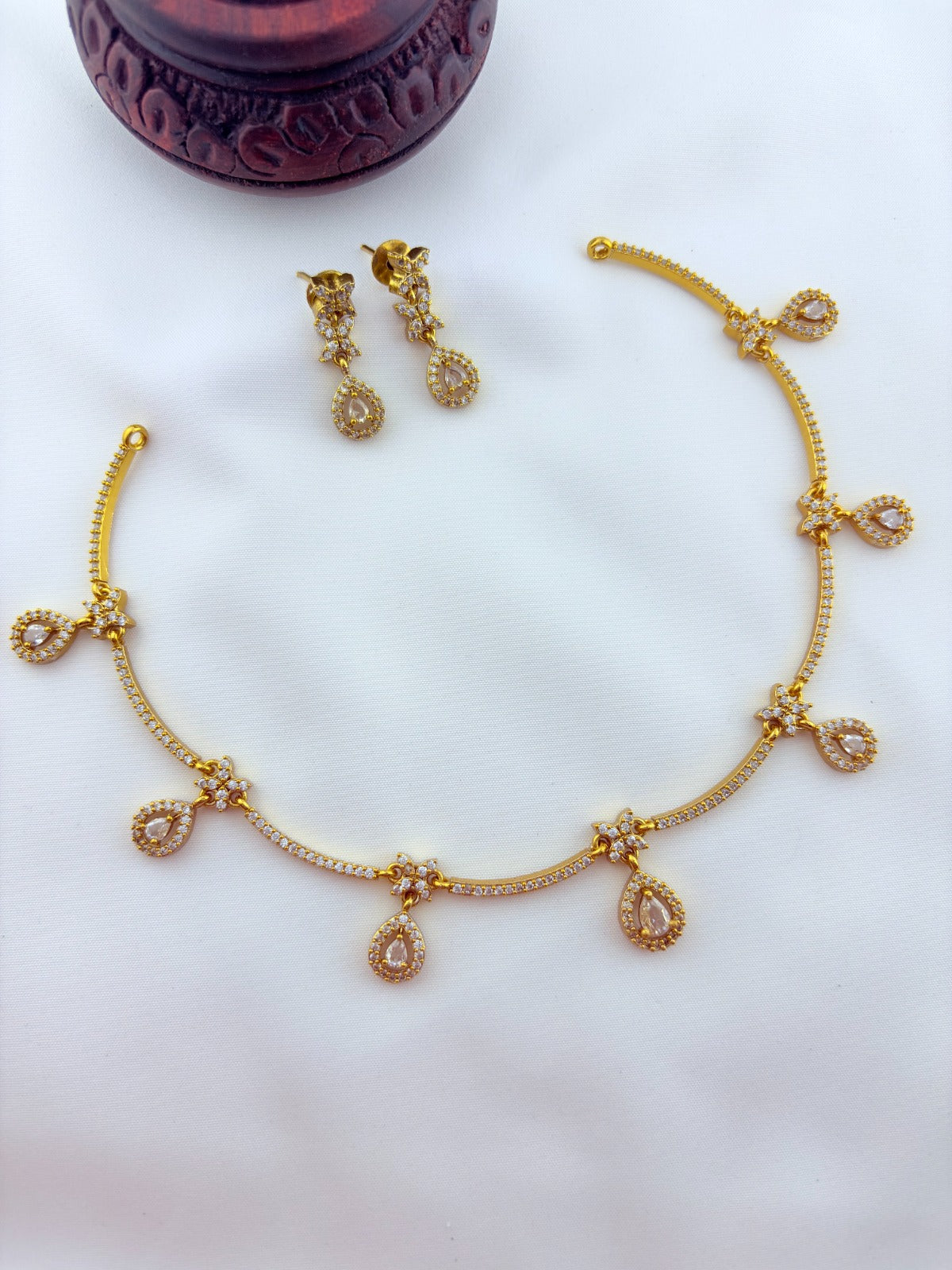 Trendy design Premium matte finish AD necklace and earrings adorned with classic stone drops