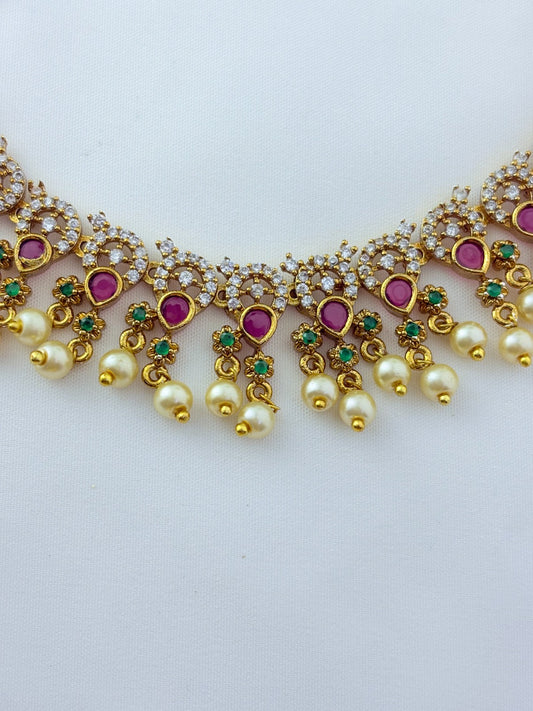 Premium matte finish neckset with classic ruby stones and pearl drops