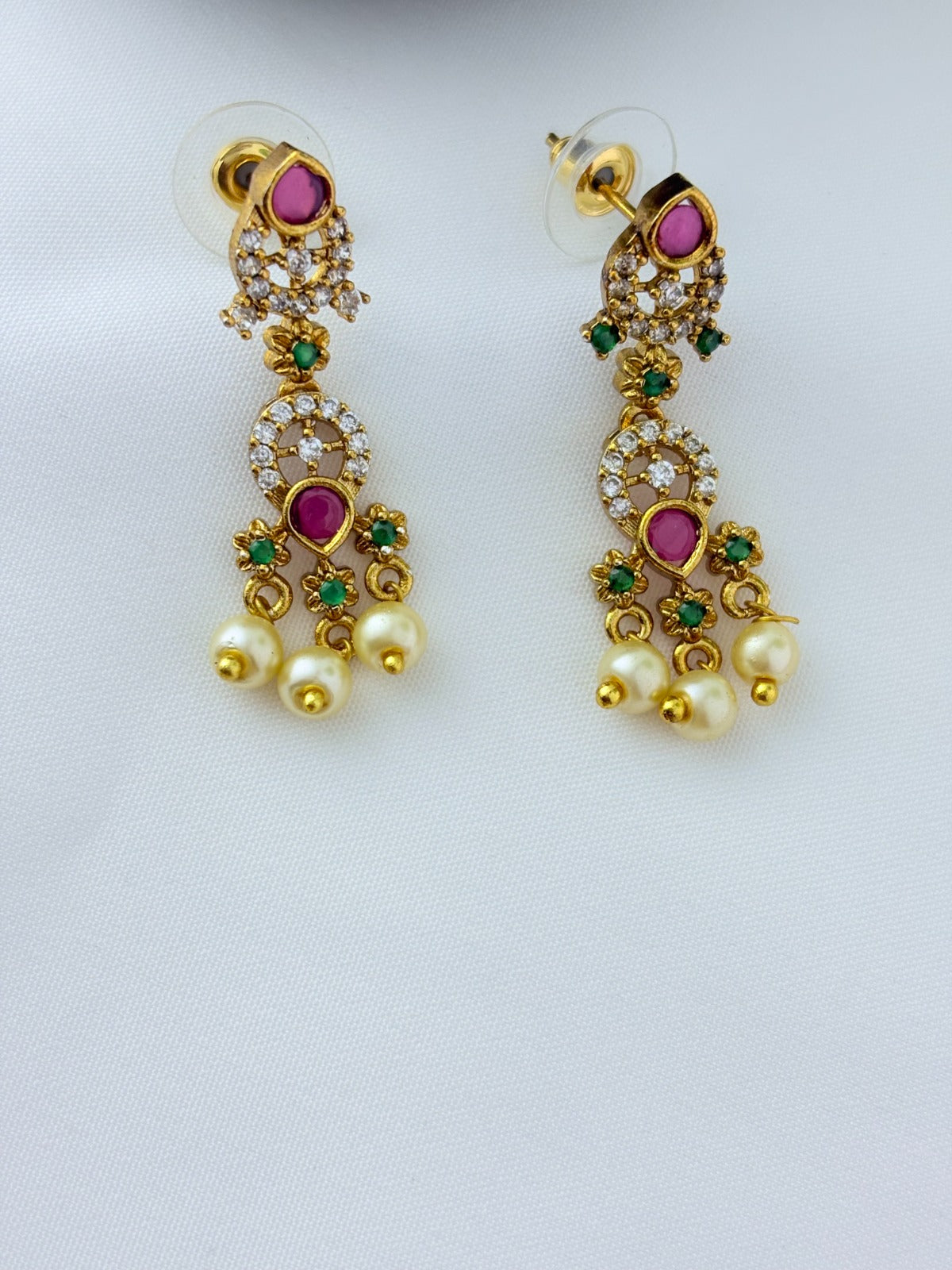 Premium matte finish neckset with classic ruby stones and pearl drops