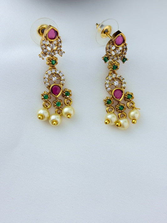 Premium matte finish neckset with classic ruby stones and pearl drops