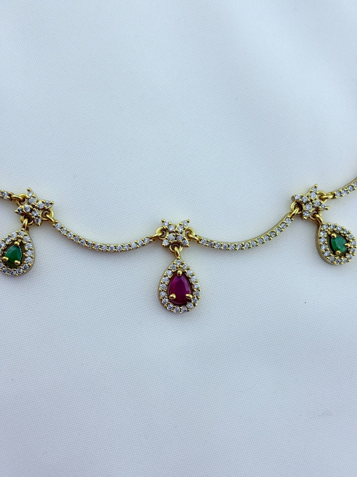 Trendy design Premium matte finish AD necklace and earrings adorned with classic stone drops