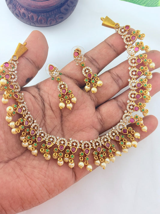 Premium matte finish neckset with classic ruby stones and pearl drops