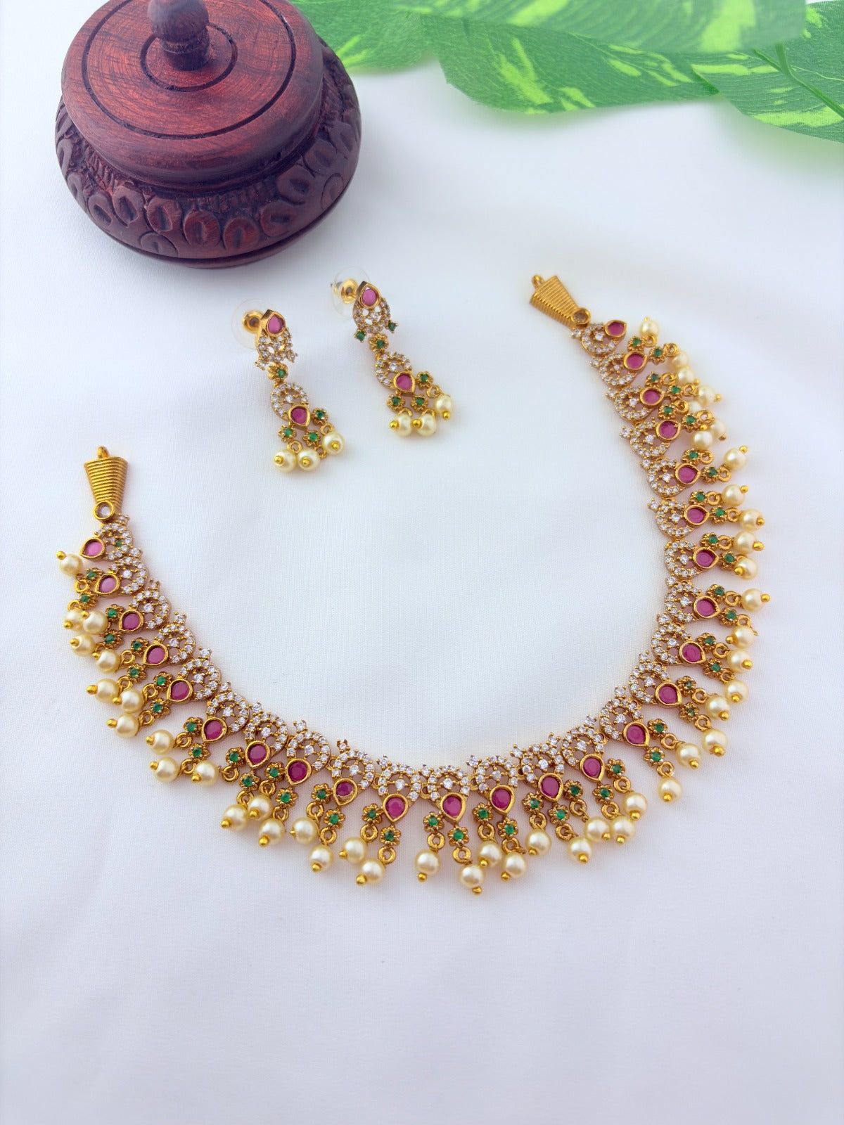 Premium matte finish neckset with classic ruby stones and pearl drops