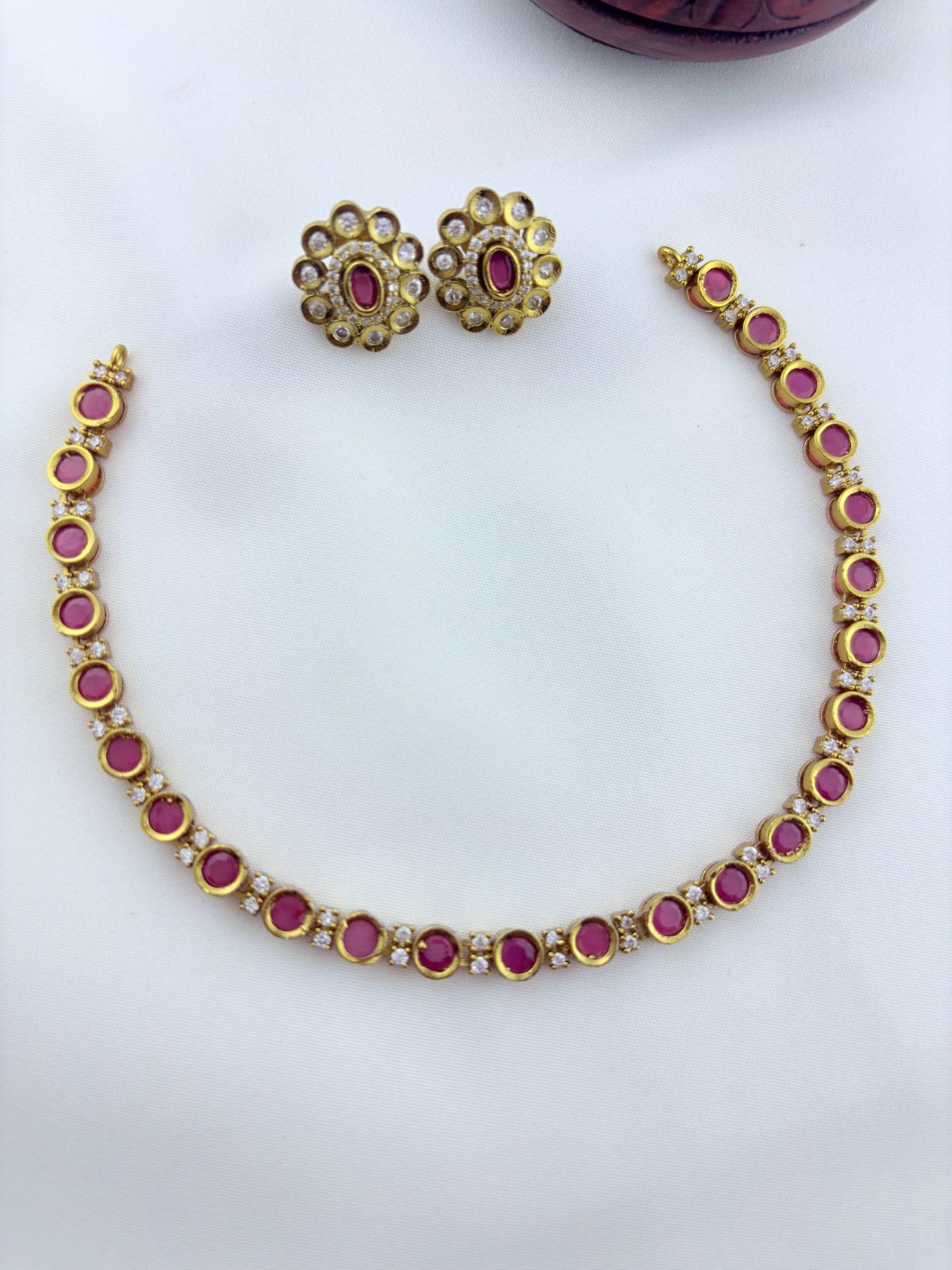 Classic traditional motifs with a trendy touch - Premium matte finish AD stone necklace with matching studs