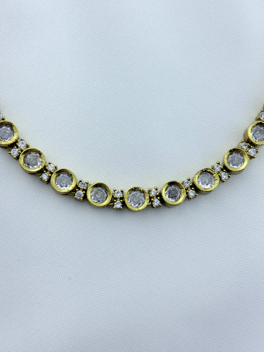 Classic traditional motifs with a trendy touch - Premium matte finish AD stone necklace with matching studs