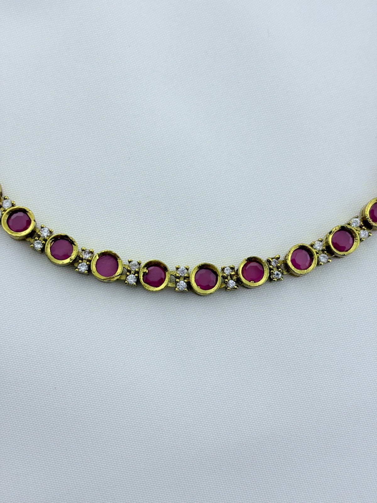 Classic traditional motifs with a trendy touch - Premium matte finish AD stone necklace with matching studs