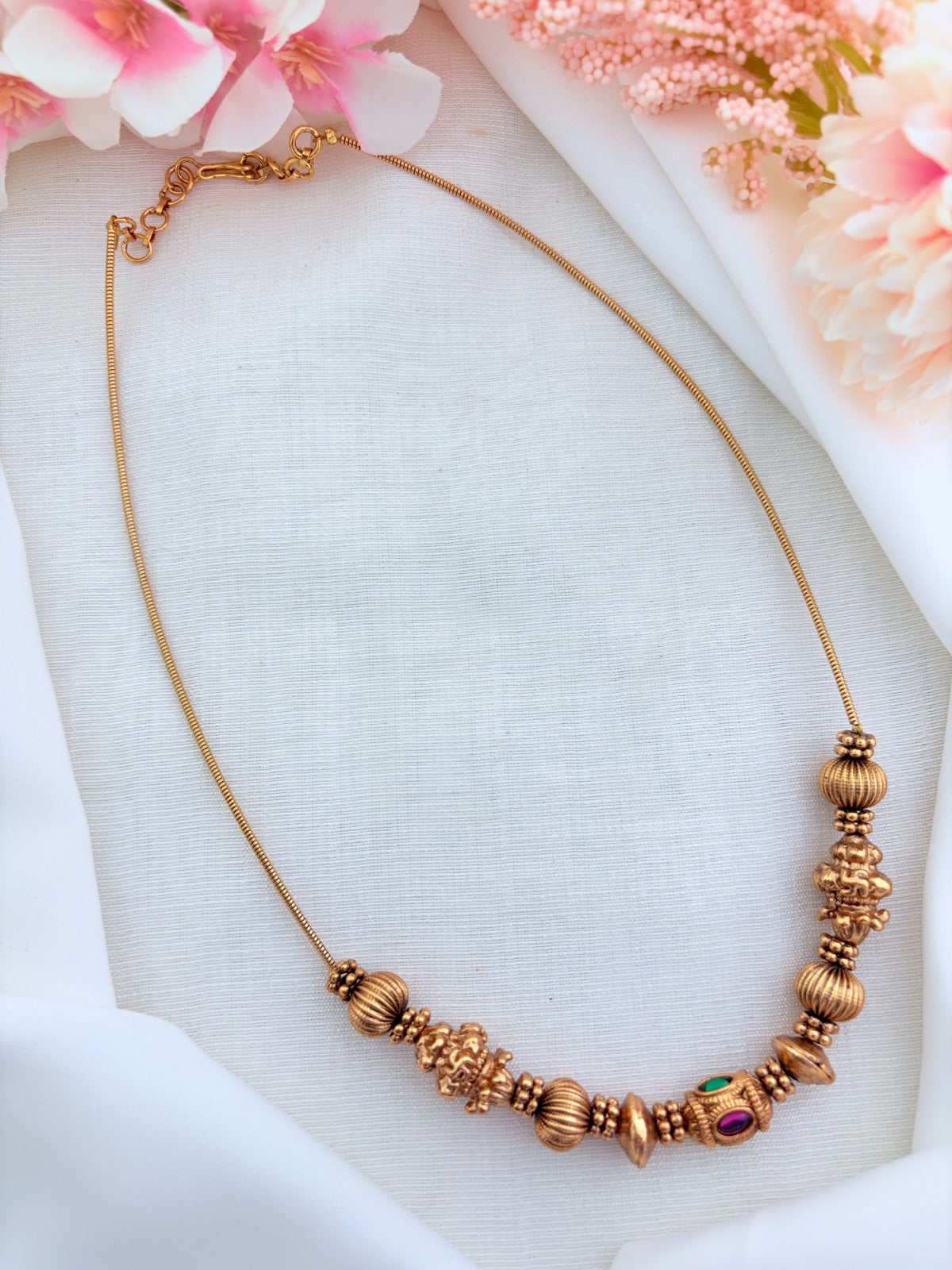 Matte finish short chain adorned with golden balls