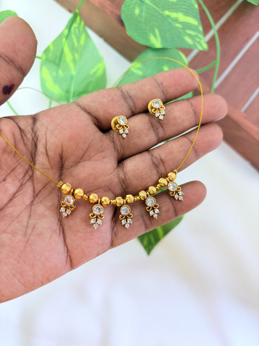 Premium invisible chain and matching earrings adorned with AD stone drops