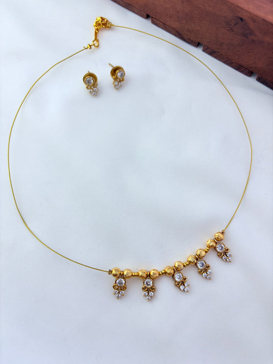 Premium invisible chain and matching earrings adorned with AD stone drops