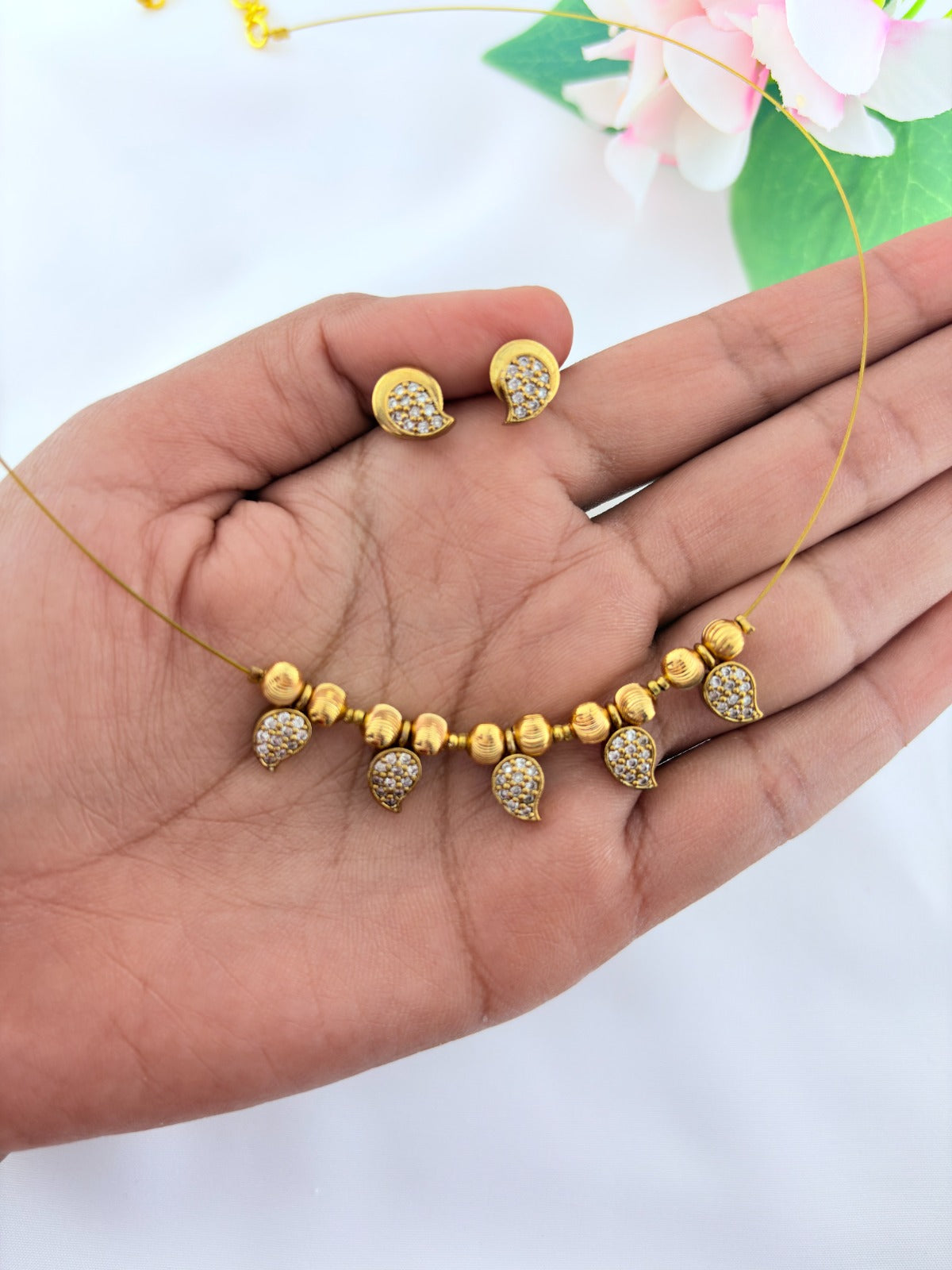 Premium invisible chain and matching earrings adorned with AD stone drops