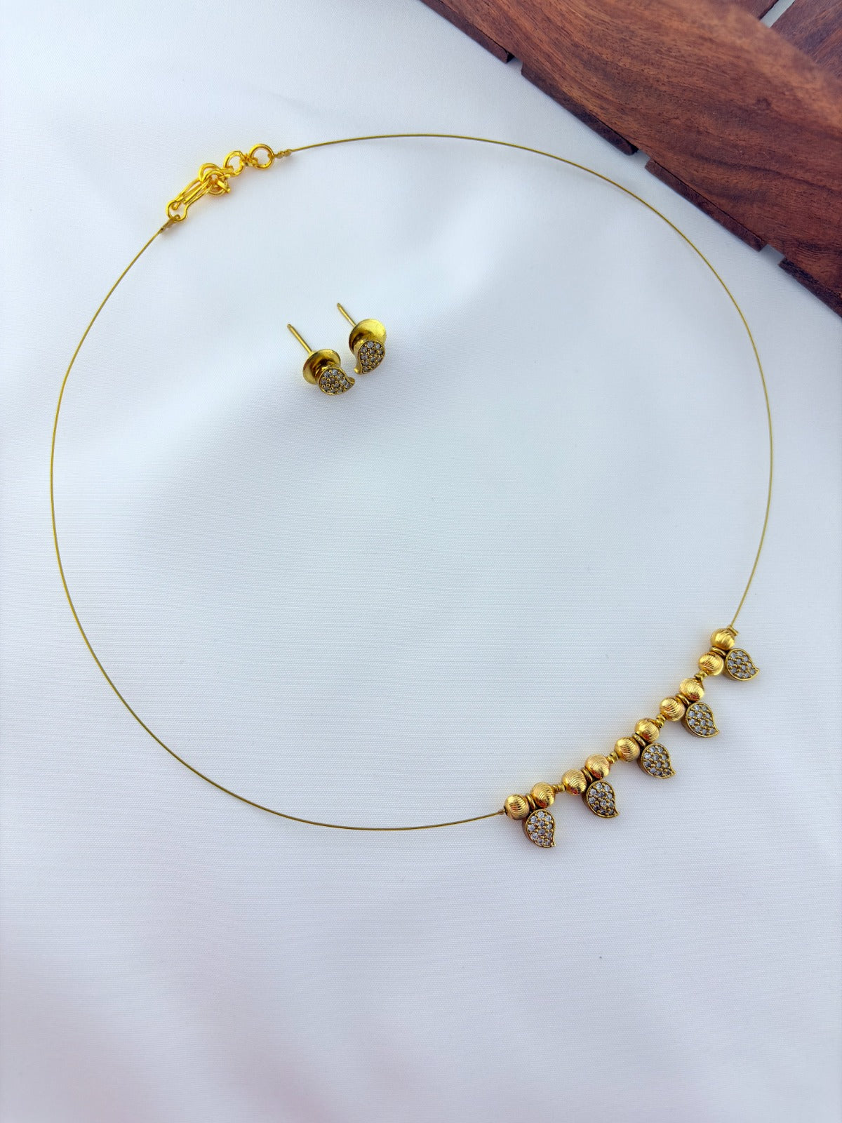 Premium invisible chain and matching earrings adorned with AD stone drops