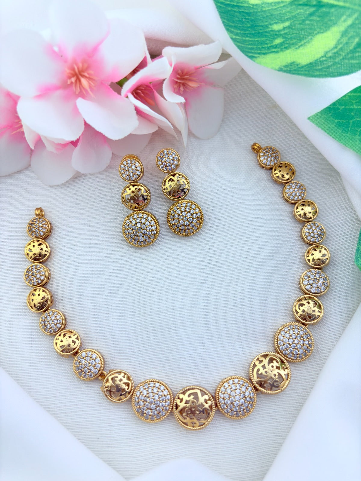 Stylish premium matte finish AD necklace and matching earrings adorned with AD stones