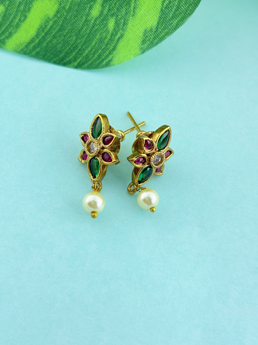 Premium antique finish necklace showcasing classic rich ruby and green stones with a lakshmi pendant and matching earrings