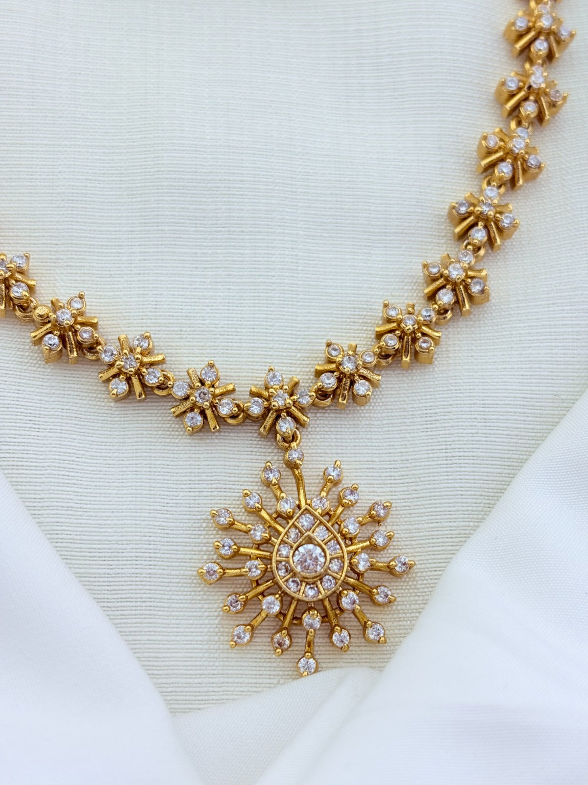 Elegant premium matte finish necklace  and earrings beautifully crafted with AD stones