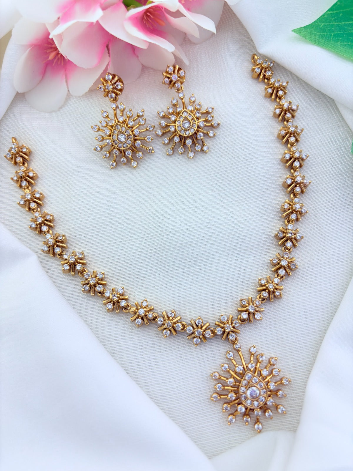 Elegant premium matte finish necklace  and earrings beautifully crafted with AD stones