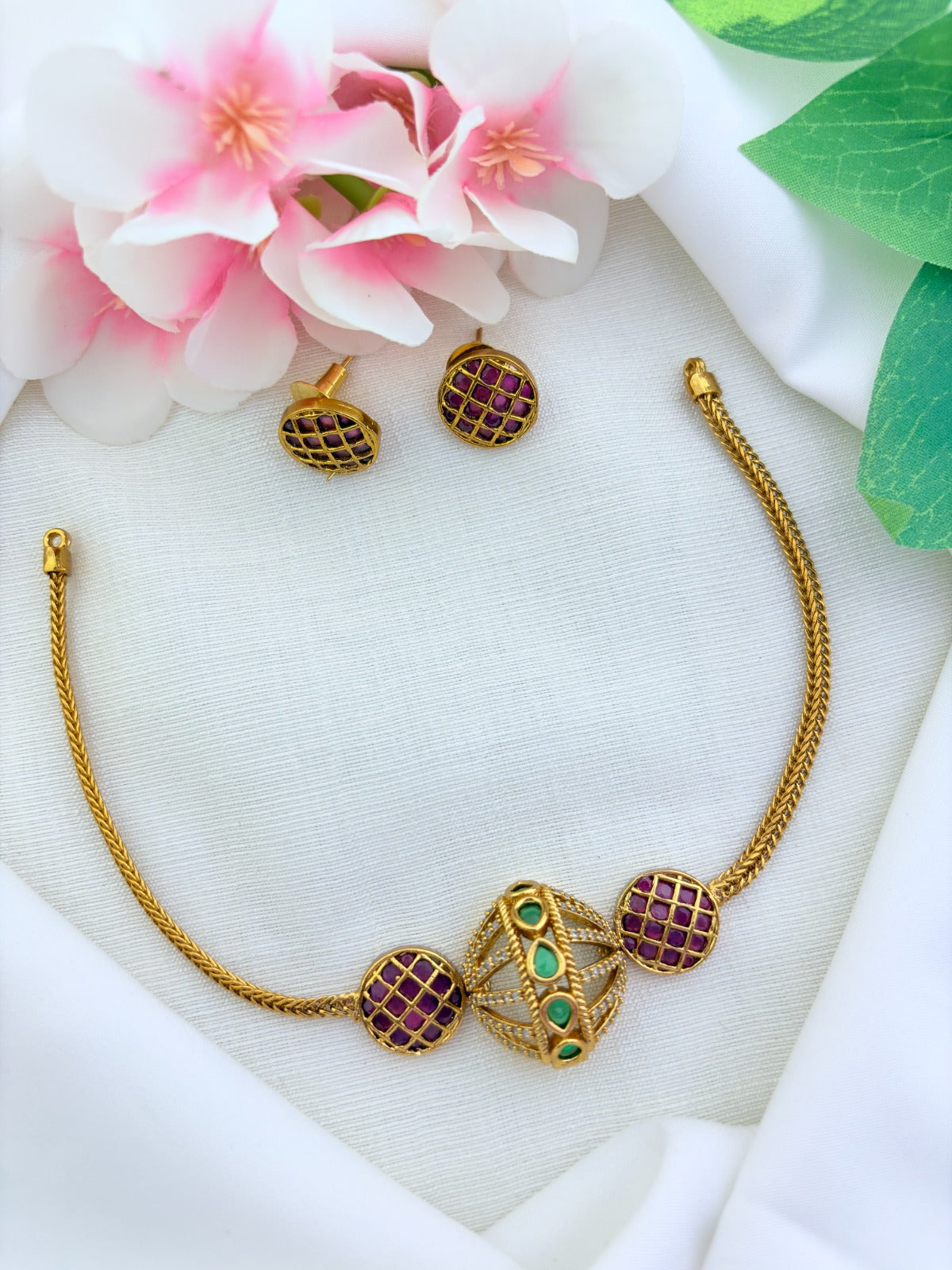 Traditional premium matte finish necklace and earrings adorned with classic stones