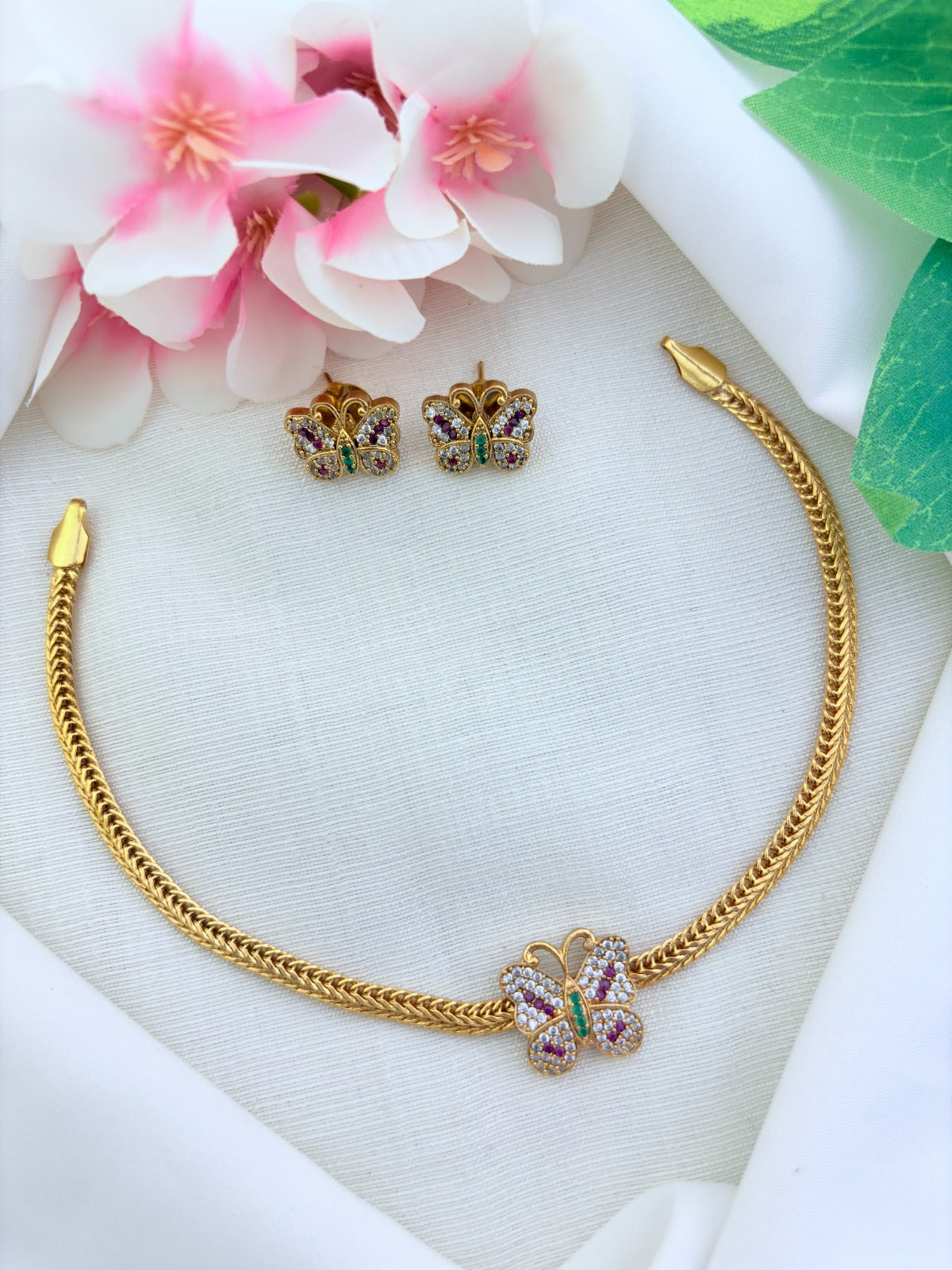 Charming butterfly pattern premium matte finish necklace and earrings  with  AD stones