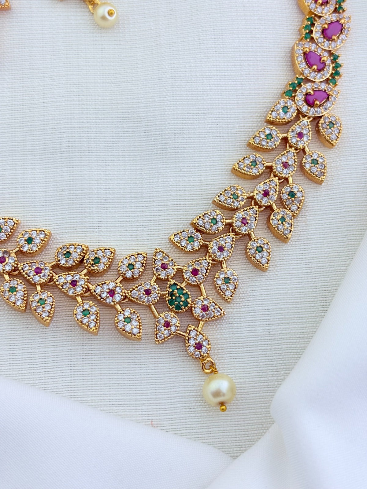 Elegant leaf pattern necklace in premium matte finish adorned with classic AD stones