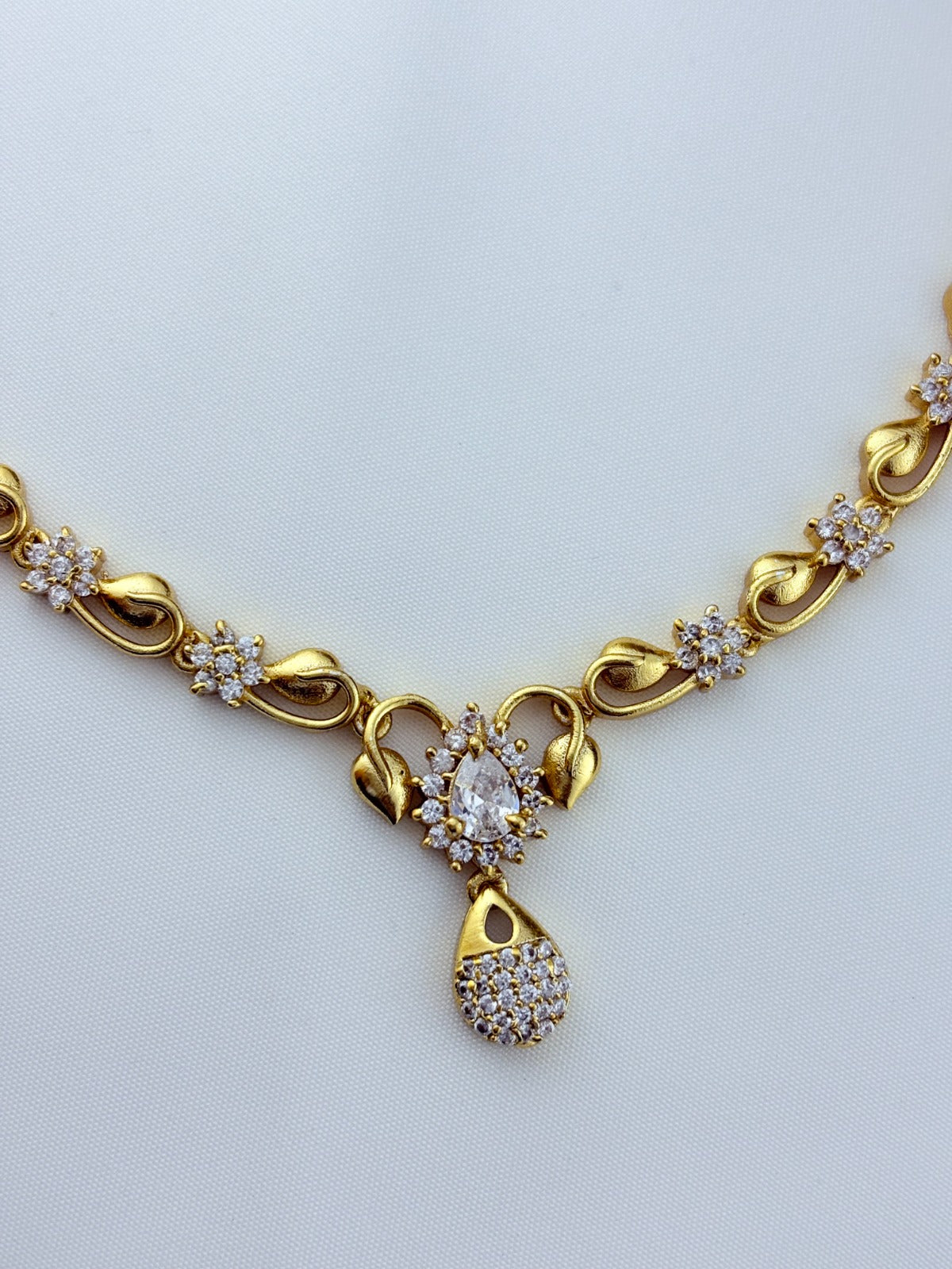 Elegant AD stone necklace in premium matte finish with matching earrings