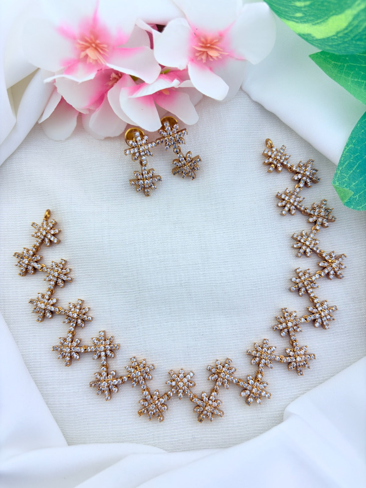 Stylish premium matte finish necklace and earrings adorned with AD stones