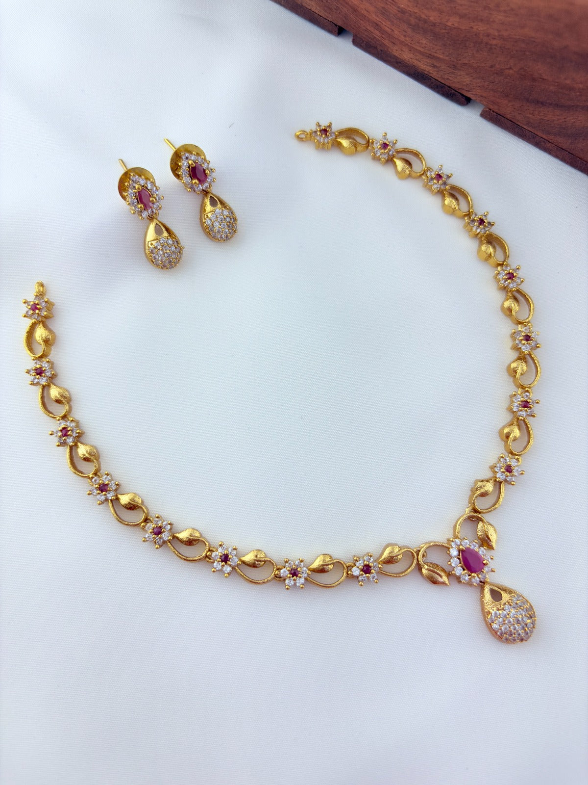 Elegant AD stone necklace in premium matte finish with matching earrings