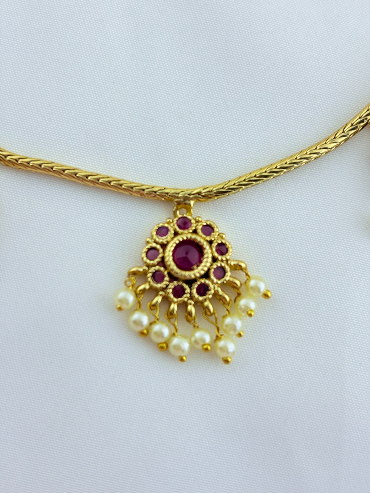 Premium matte finish necklace and matching earrings  crafted with kemp pendant adorned with pearl drops