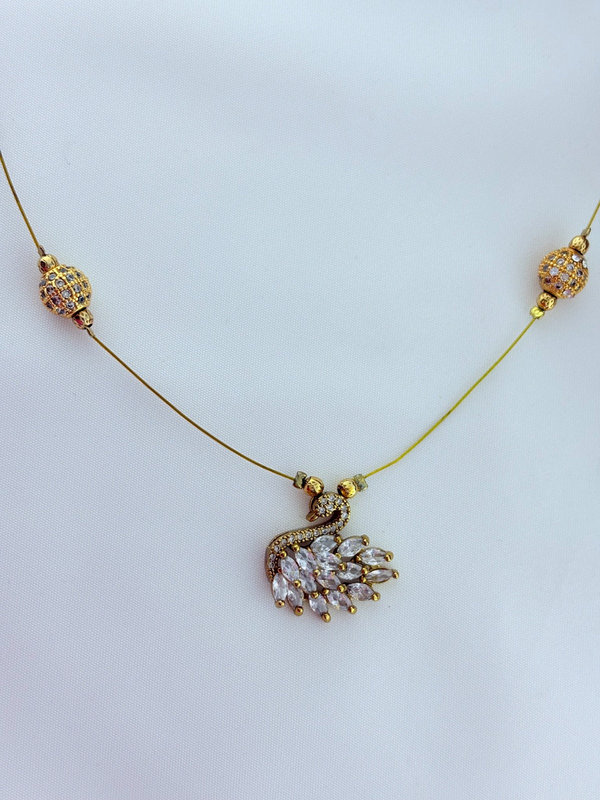 Premium invisible  chain adorned with AD stone balls and CZ stone duck pendant