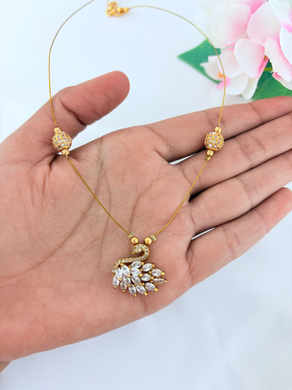 Premium invisible  chain adorned with AD stone balls and CZ stone duck pendant