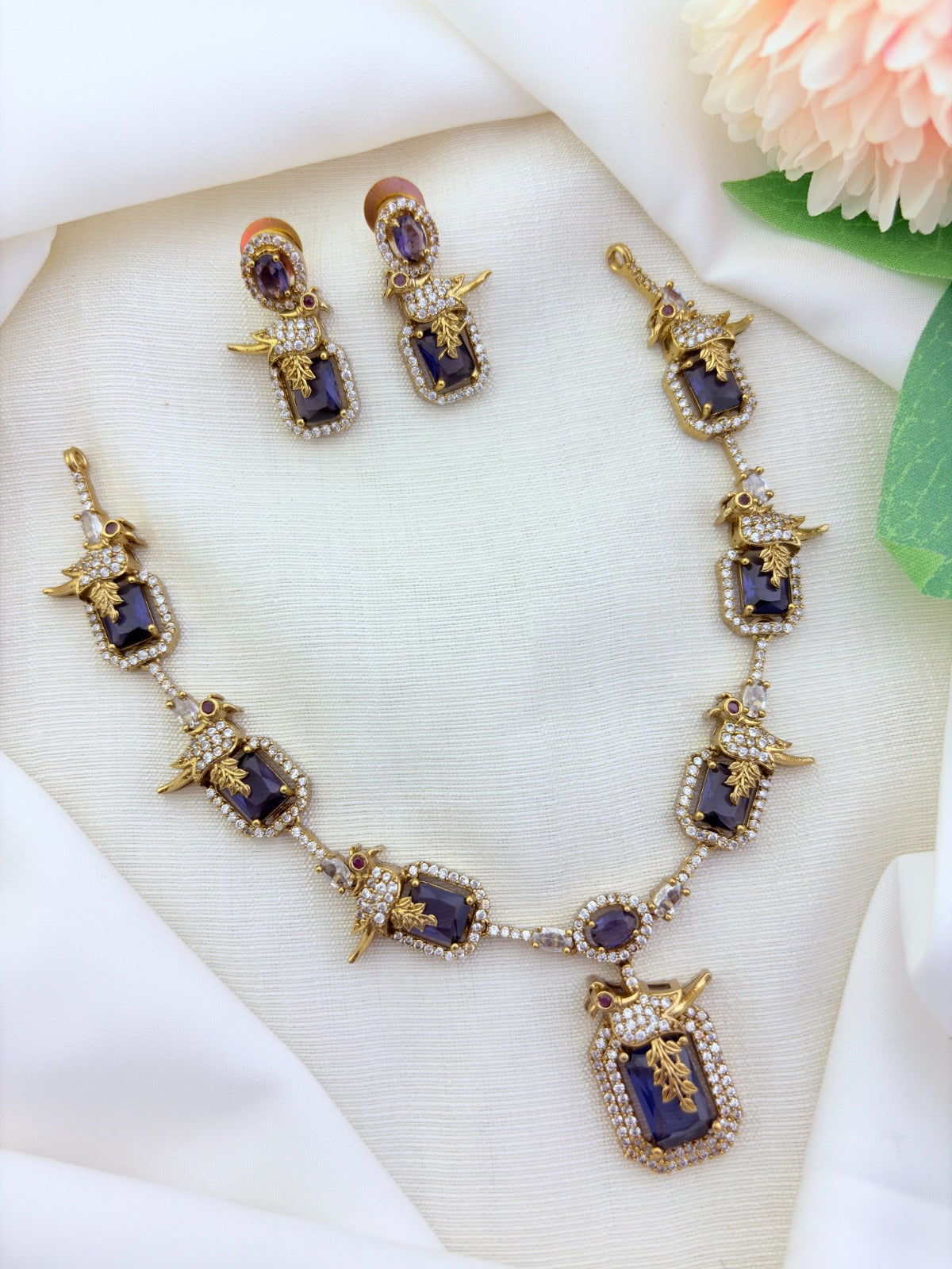 Stylish peacock pattern necklace featuring classic stones in premium matte finish with matching earrings