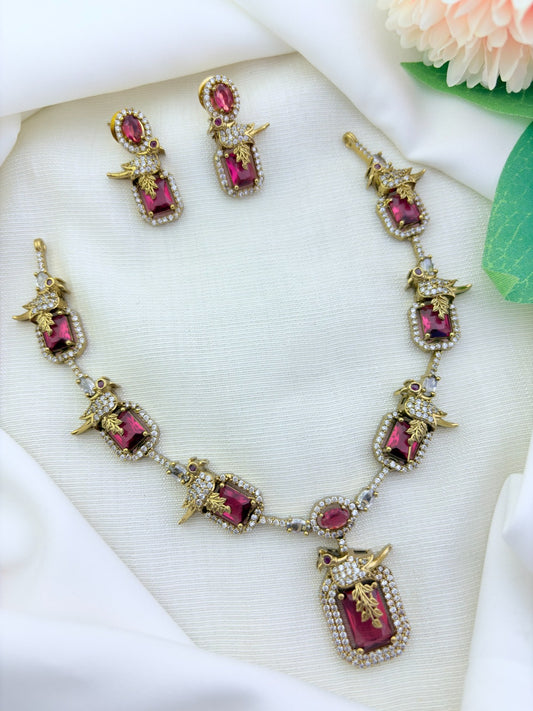 Stylish peacock pattern necklace featuring classic stones in premium matte finish with matching earrings