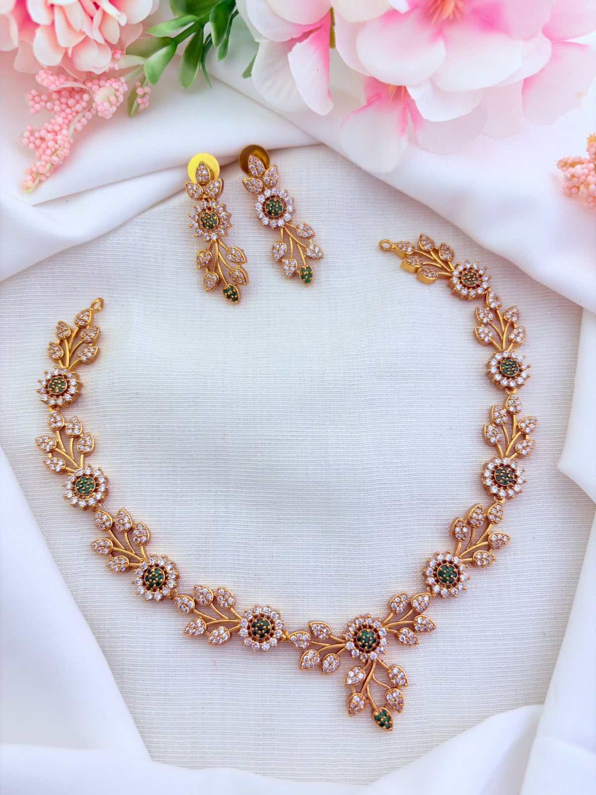 Classic leaf and floral pattern in premium matte finish adorned with AD stones