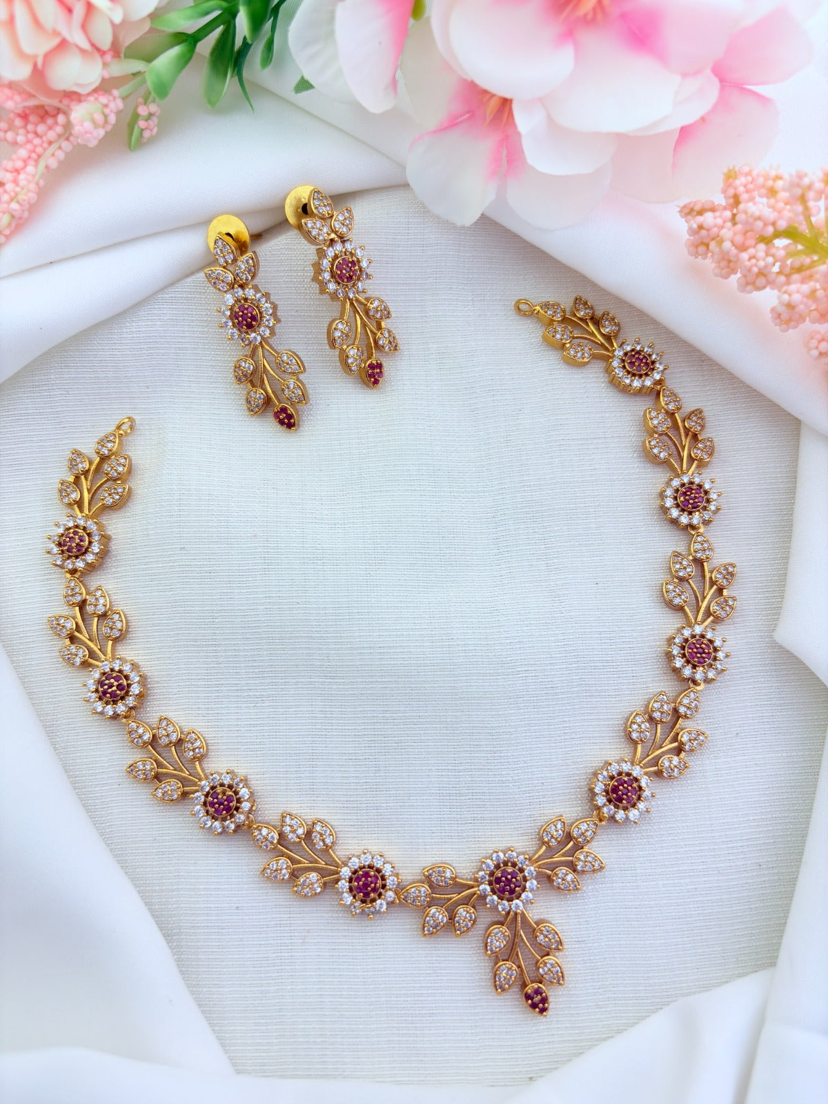 Classic leaf and floral pattern in premium matte finish adorned with AD stones