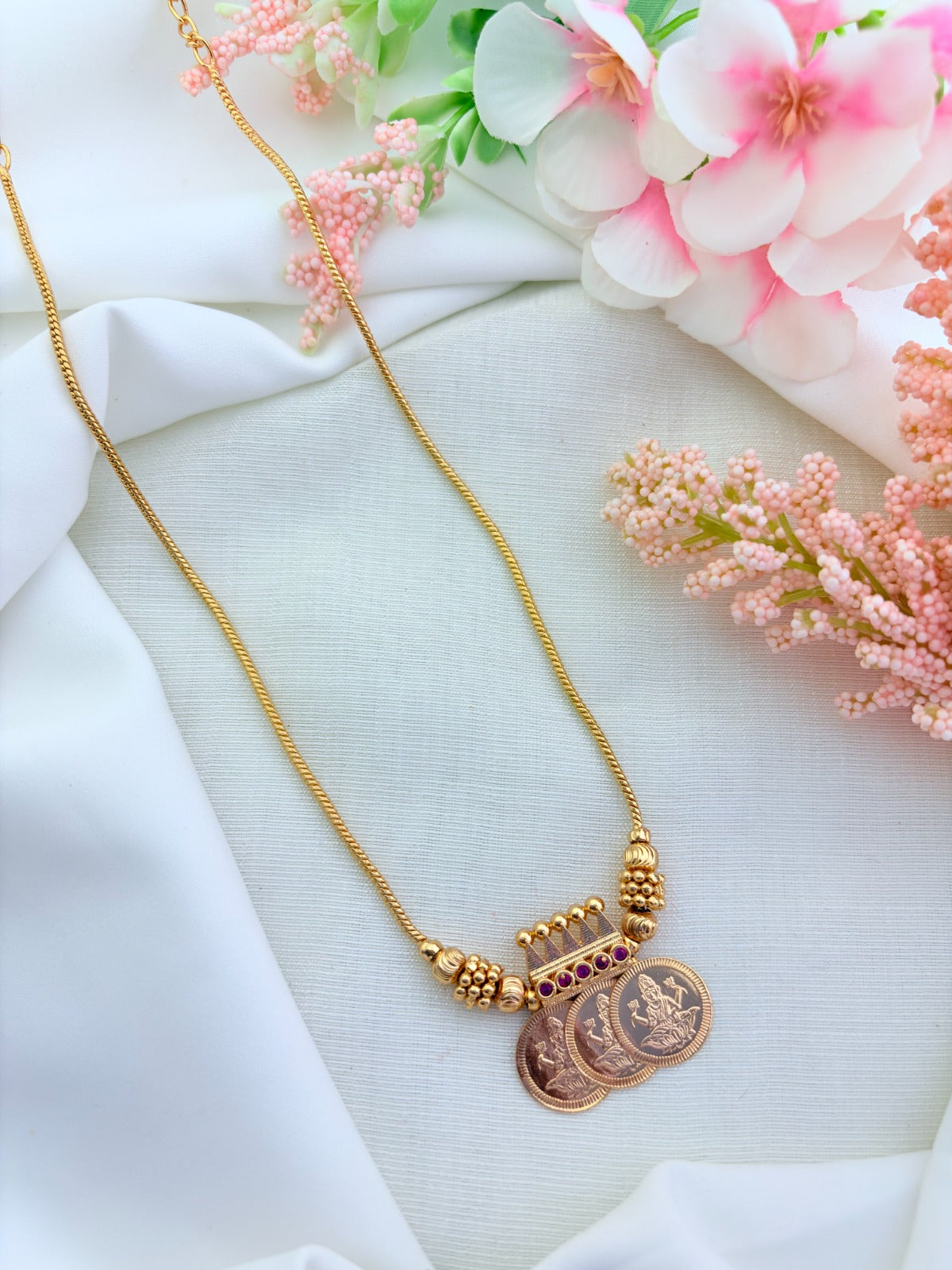 Traditional lakshmi coin chain in microgold polish highlighted with ruby stones