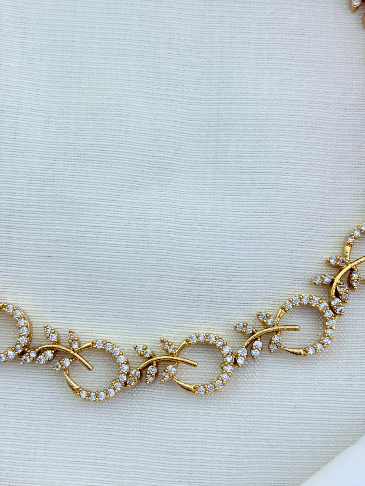 Beautifully crafted Premium matte finish necklace and earrings adorned with AD stones