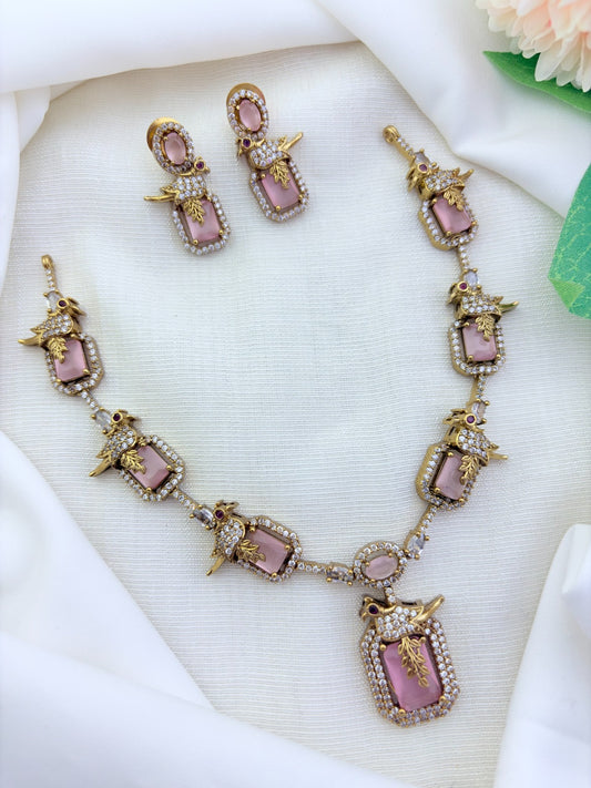 Stylish peacock pattern necklace featuring classic stones in premium matte finish with matching earrings