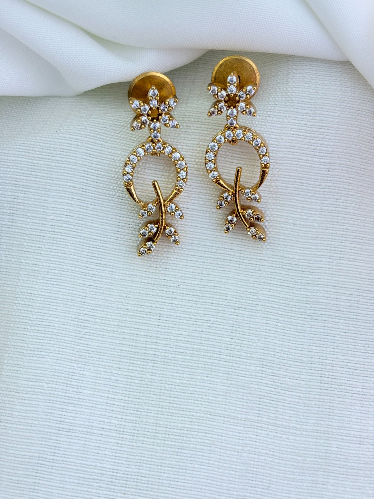 Beautifully crafted Premium matte finish necklace and earrings adorned with AD stones