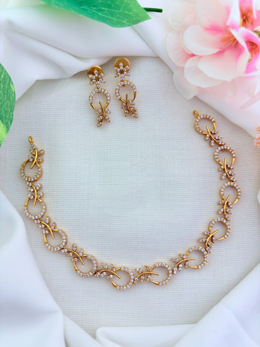 Beautifully crafted Premium matte finish necklace and earrings adorned with AD stones