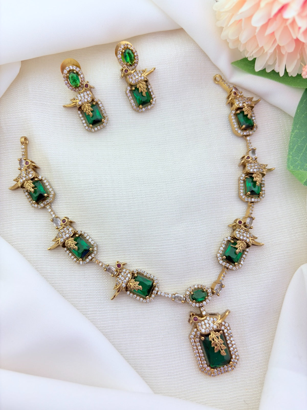 Stylish peacock pattern necklace featuring classic stones in premium matte finish with matching earrings