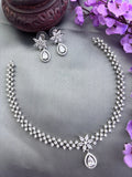 Elegant premium AD stone necklace paired with matching earrings in silver finish