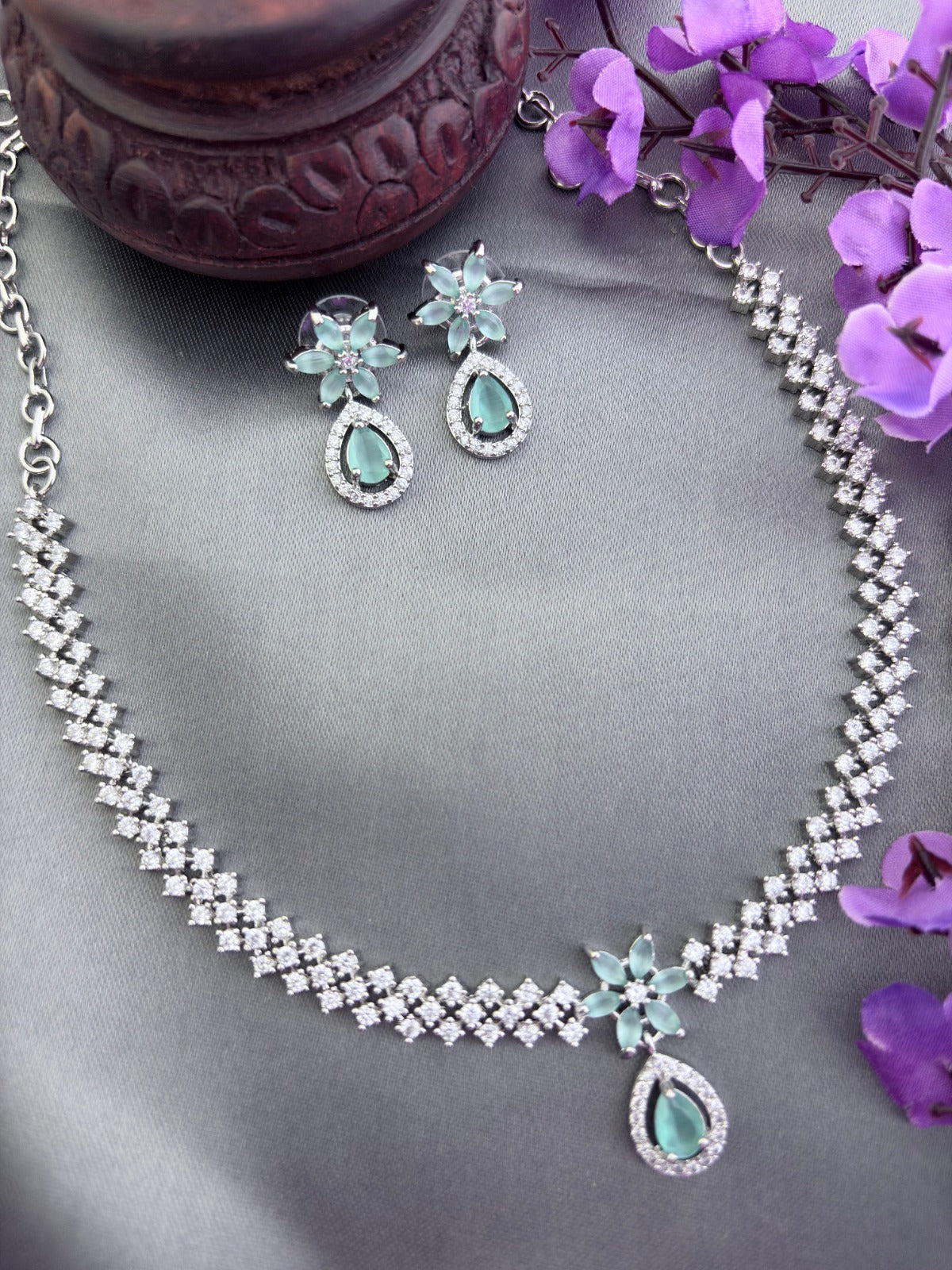 Elegant premium AD stone necklace paired with matching earrings in silver finish