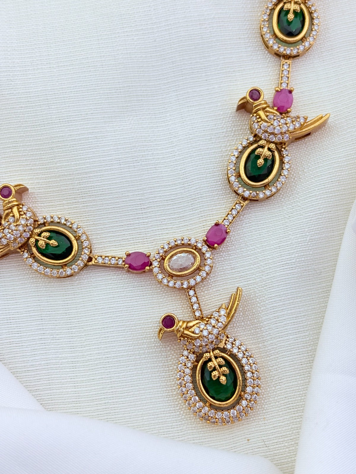 Peacock pattern in modern elegance crafted with classic stones - premium matte finish necklace with matching earrings