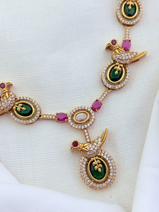 Peacock pattern in modern elegance crafted with classic stones - premium matte finish necklace with matching earrings