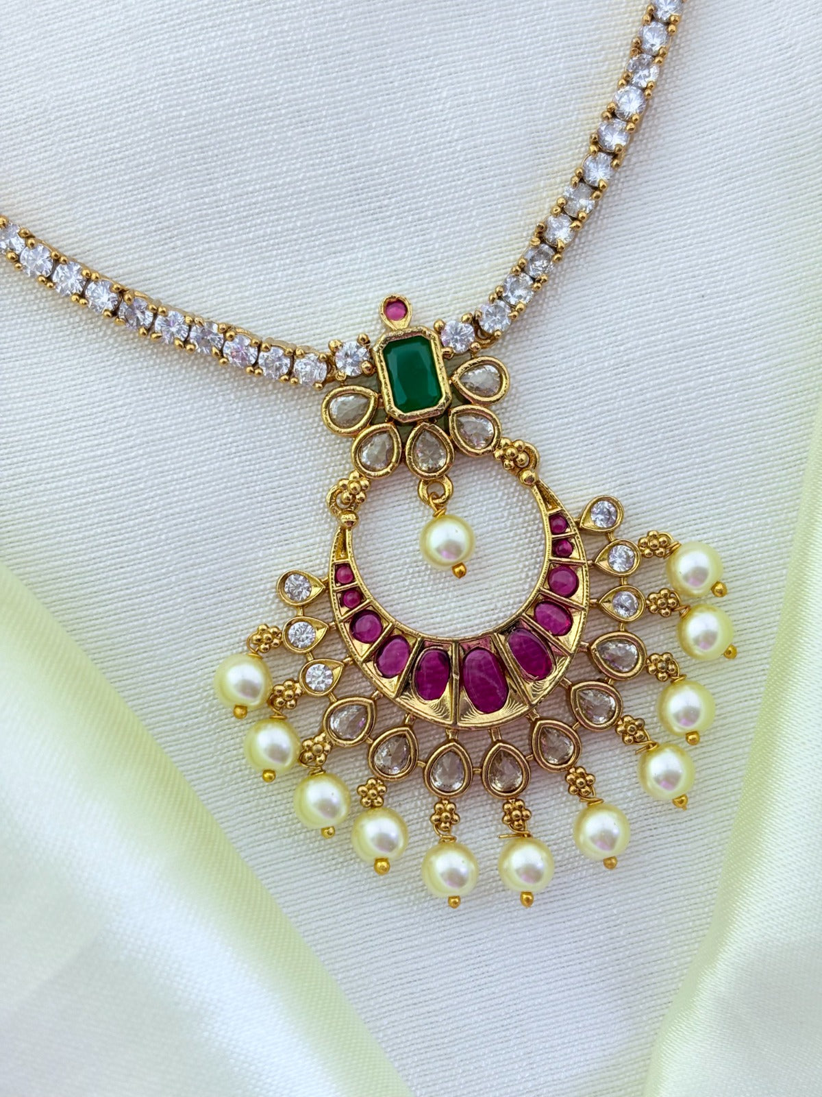 Premium matte finish necklace beautifully crafted with classic stones and pearl drops